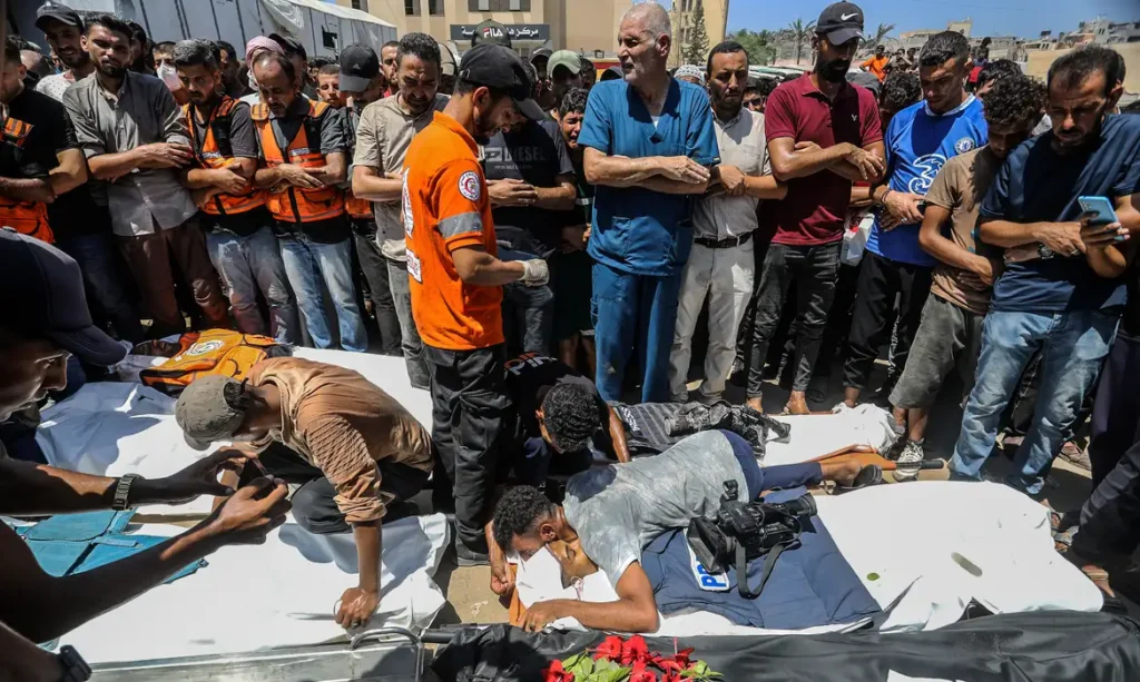 KHAN YUNIS, GAZA - AUGUST 25: (EDITOR'S NOTE: Image depicts death) A funeral ceremony is being held in the courtyard of Nasser Hospital for Reuters photojournalist Hossam al-Masri, Al Jazeera cameraman Mohammed Salameh, journalist Maryam Abu Deqqa, who worked with several media outlets including Independent Arabia and AP, and NBC News journalist Moaz Abu Taha, all of whom were killed in an Israeli attack on the hospital in Khan Yunis, Gaza on August 25, 2025. Relatives and colleagues of the slain journalists expressed deep grief during the ceremony. Abed Rahim Khatib / AnadoluNo Use USA No use UK No use Canada No use France No use Japan No use Italy No use Australia No use Spain No use Belgium No use Korea No use South Africa No use Hong Kong No use New Zealand No use Turkey